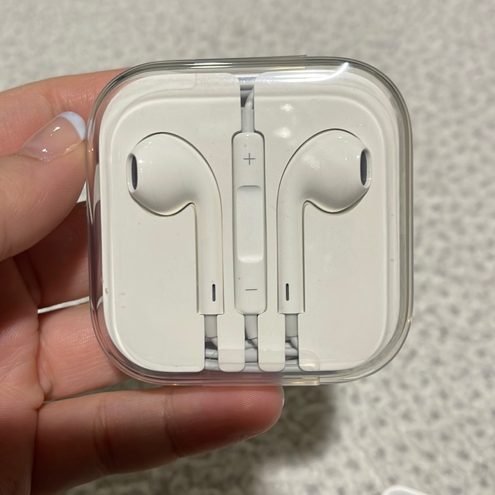 Apple headphones and charging brick